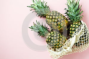 Fresh tree pineapple on pink background. Summer concept. Creative flat lay with copy space.