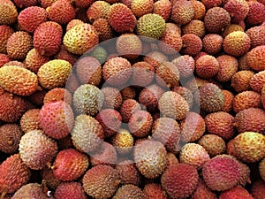 Fresh tropical fruit lychee on the shop counter. Textural background