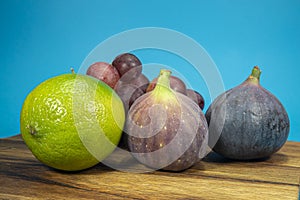 Fresh tropical fruit with ripe figs lime and grapes