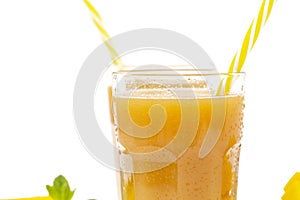 Fresh tropical fruit smoothie mango juice and fresh mango on a white background.