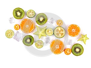 Fresh tropical slices of fruits isolated on white background. Juicy oranges, kiwis, carambolas and ice.