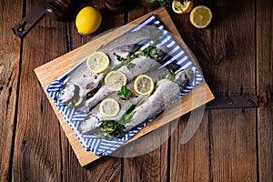 Fresh trout with lemon and different herbs