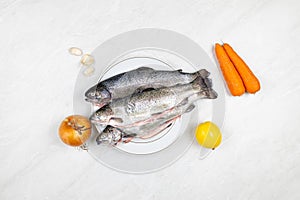 Fresh trout on the plate ready for preparing