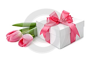 Fresh Tulips and boxes with gifts on white background