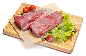 Fresh tuna Fish steak on a wooden cutting serving board isolated on a white background