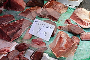 Fresh tuna sold at a market in Italy with sign Tonno (translation: tuna) and price