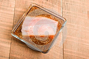 Fresh tuna steak marinating in bowl