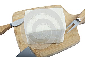 Fresh Turkish Feta Cheese. Healthy ingredient for cooking salad. Crumbled feta cheese on cutting board