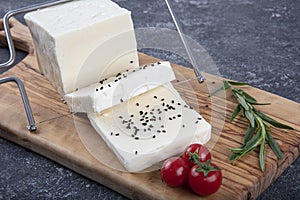 Fresh Turkish Feta Cheese. Healthy ingredient for cooking salad. Crumbled feta cheese on cutting board