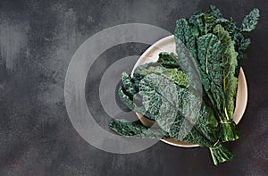 Fresh  Tuscan kale leaves on a white plate