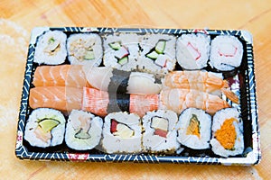 Fresh unbox sushi prepared to be eaten photo