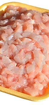 Fresh uncooked chicken breast meat pieces, packed and ready to cook