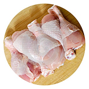 Fresh uncooked chicken meat drumsticks pieces, baget ready to cook