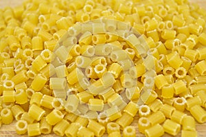 Fresh uncooked gold colored pasta