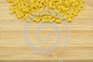 Fresh uncooked gold colored pasta. Dining, lunch.