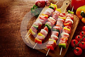 Fresh uncooked meat kebabs ready for grilling