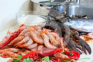 Fresh uncooked sea food specialties and rice photo