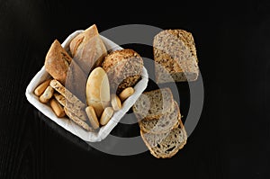 Fresh variety bread on black background