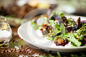 Fresh vegan salad. Avocado, couscous, melon, portobello, soybean, tofu on white plate. Delicious healthy mixed greens