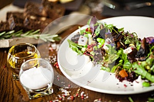 Fresh vegan salad. Avocado, couscous, melon, portobello, soybean, tofu on white plate. Delicious healthy mixed greens