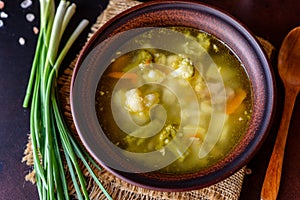 Fresh vegan soup with broccoli, cauliflower, asparagus and carrots