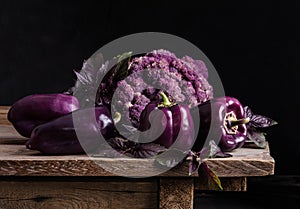 Fresh vegetable. Dark purple peppers, cauliflower, leaves of basil