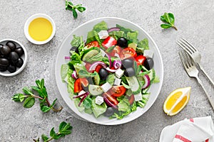 Fresh vegetable greek salad with lettuce, olives and feta cheese