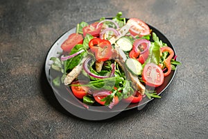 Fresh vegetable salad with chicken meat, herbs and olive oil