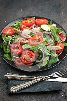 Fresh vegetable salad with chicken meat, herbs and olive oil