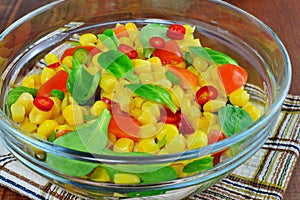 Fresh vegetable salad with corn, lamb`s lettuce, chilly, sweet pepper