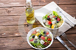 Fresh vegetable salad with feta cheese, fresh lettuce, cherry tomatoes, red onion and pepper