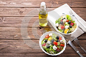 Fresh vegetable salad with feta cheese, fresh lettuce, cherry tomatoes, red onion and pepper