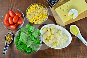 Fresh vegetable salad ingredients, sweet corn, lamb`s lettuce, cheese, chilly, sweet pepper