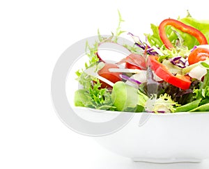 Fresh vegetable salad isolated on white