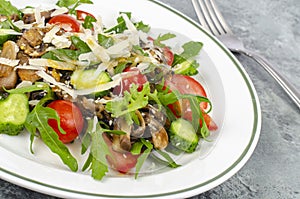 Fresh vegetable salad with mushrooms and cheese. Healthy lifestyle. Studio Photo