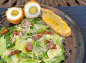 Fresh vegetable salad plate on table background