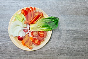 Fresh vegetable salad with red cabbage, cucumber, radish, carrots, sweet peppers,