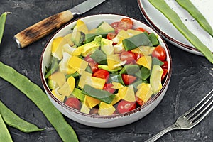Fresh vegetable salad with runner beans in bowl