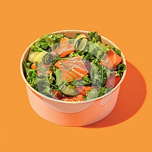 Fresh vegetable salad with salmon - tomatoes, avocado, cucumbers, and mix lettuce leaves.Fish salad. Healthy food. Isolated,