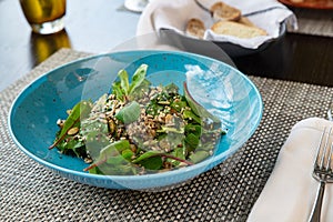 Fresh vegetable salad on wooden background.