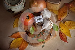 Fresh vegetable soup ingredients autumn leaves wooden table