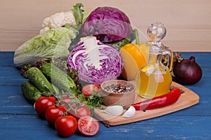 Fresh vegetables on a blue wooden table. Ingredients for cooking