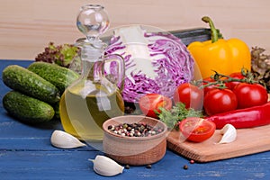 Fresh vegetables on a blue wooden table. Ingredients for cooking