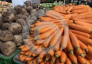 Fresh vegetables, carrot on shelves in supermarket