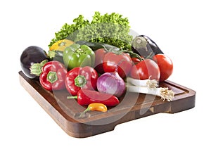 Fresh vegetables on chopping board photo