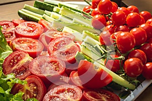Fresh vegetables closeup: lettuce, tomatoes, cucumbers