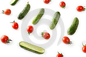 Fresh vegetables - cucumbers and tomatoes on white background. P