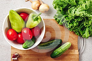 Fresh vegetables on a cutting board, salad ingredients