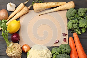 Fresh vegetables on dark wooden background. Mockup for menu or recipe. Top view with copy space