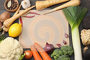 Fresh vegetables on dark wooden background. Mockup for menu or recipe. Top view with copy space